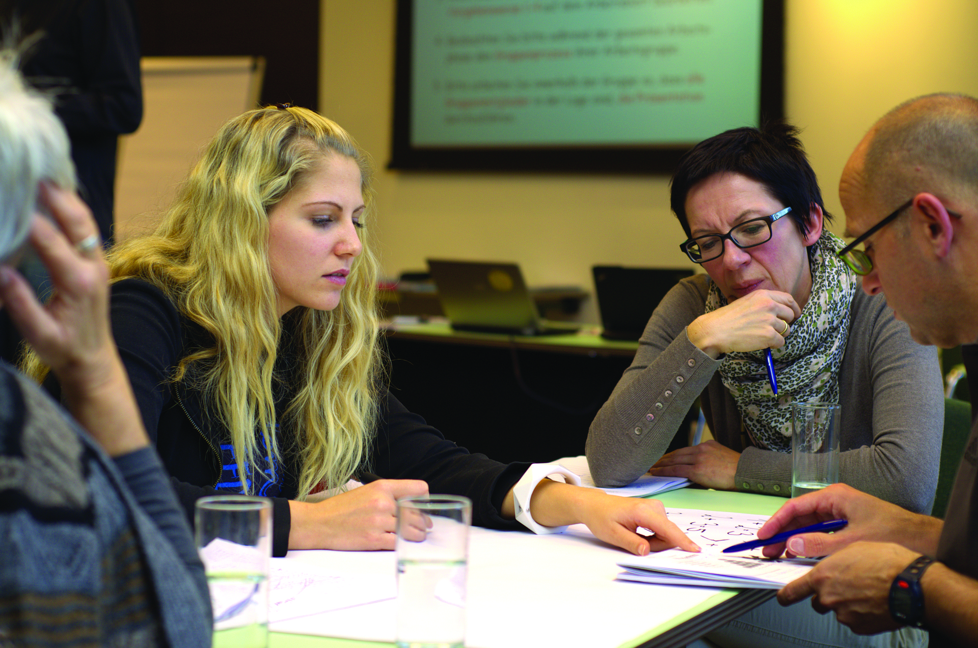 Men and women in work meeting